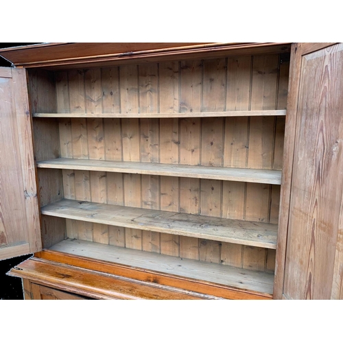 1012 - A large Victorian pitch pine housekeeper's cupboard with fitted shelves. Circa 1880. 164x45x218.5cm