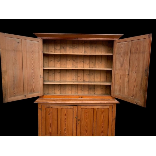 1012 - A large Victorian pitch pine housekeeper's cupboard with fitted shelves. Circa 1880. 164x45x218.5cm