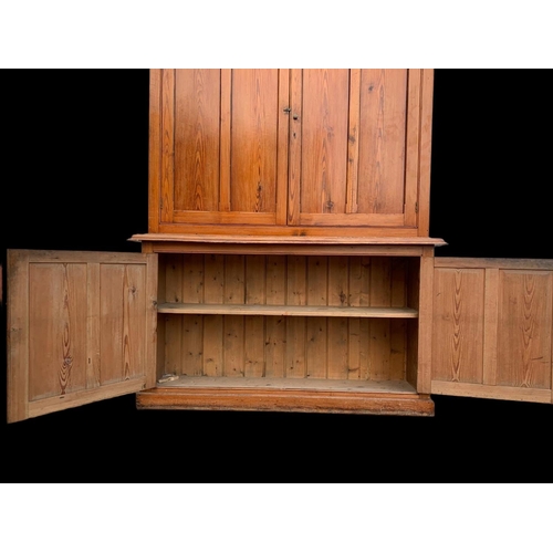 1012 - A large Victorian pitch pine housekeeper's cupboard with fitted shelves. Circa 1880. 164x45x218.5cm