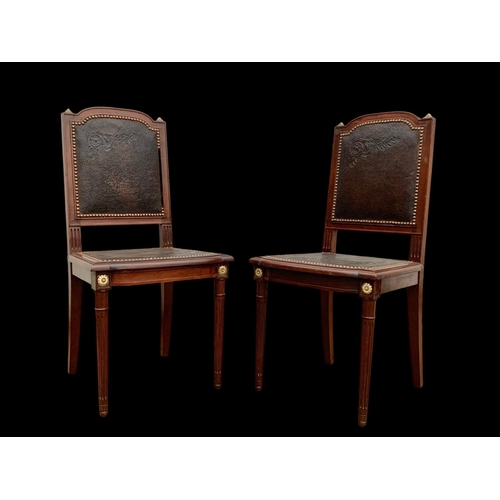 1019 - A pair of 19th century French mahogany side chairs with leather back and seats and brass decoration.... 