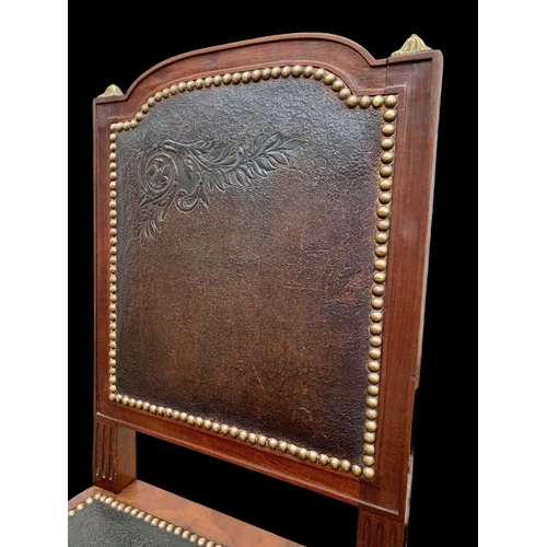 1019 - A pair of 19th century French mahogany side chairs with leather back and seats and brass decoration.... 