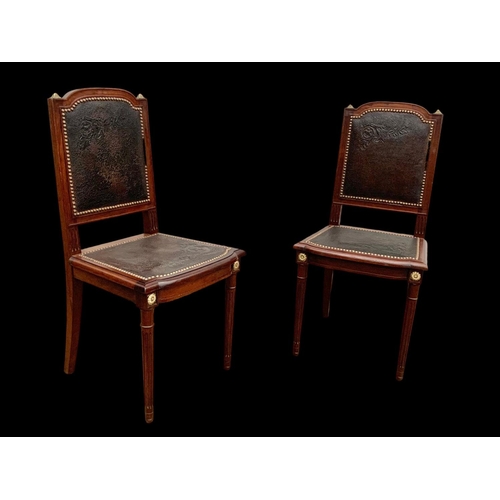 1019 - A pair of 19th century French mahogany side chairs with leather back and seats and brass decoration.... 