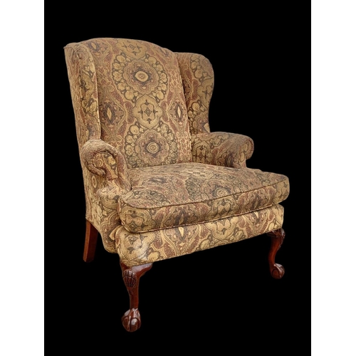 1045 - A large Georgian style wingback armchair. 90 x 73 x 112cm.