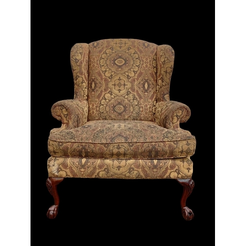 1045 - A large Georgian style wingback armchair. 90 x 73 x 112cm.