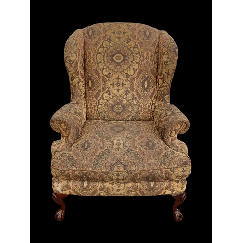 1045 - A large Georgian style wingback armchair. 90 x 73 x 112cm.