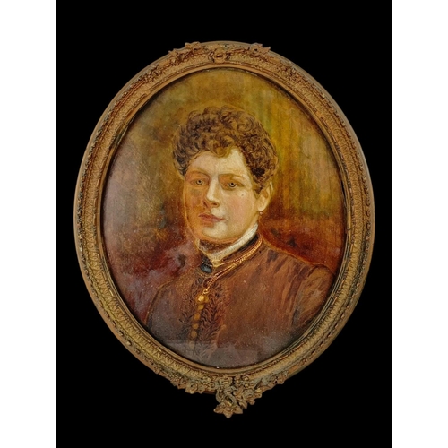 106 - A Victorian oil painting of a lady in an ornate gilt frame. 44 x 54cm including frame.