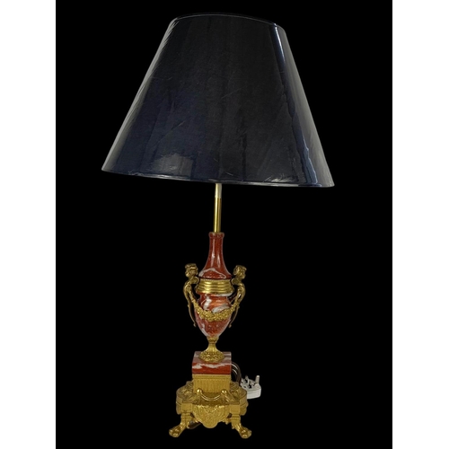 14 - An ornate brass and marble table lamp. Base measures 54cm. 77cm with shade.