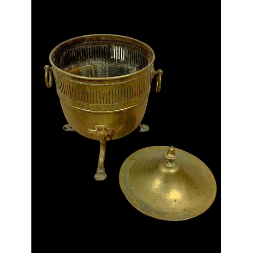 17 - A Victorian brass coal bucket with lid and 2 ring handles. 37 x 34 x 52cm.