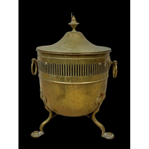 17 - A Victorian brass coal bucket with lid and 2 ring handles. 37 x 34 x 52cm.
