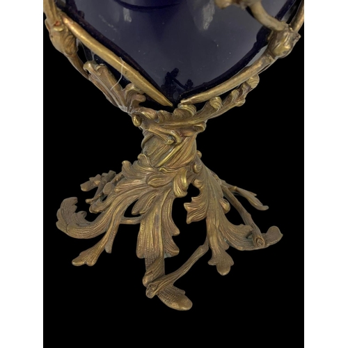 23 - A vintage ornate brass and blue porcelain egg jar and lid. 38cm.