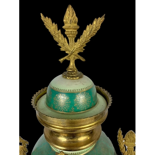 26 - An early 20th century French porcelain and brass clock set. Clock measures 28 x 59cm. Candelabras me... 