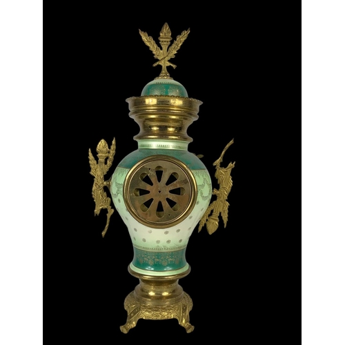 26 - An early 20th century French porcelain and brass clock set. Clock measures 28 x 59cm. Candelabras me... 