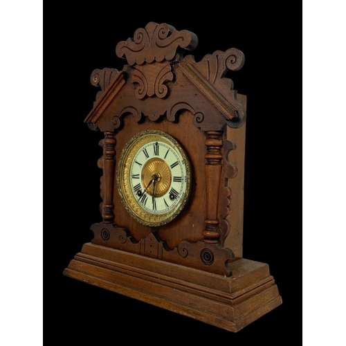 29 - A late 19th century American Gingerbread mantle clock. Circa 1890. 35 x 14 x 42cm.
