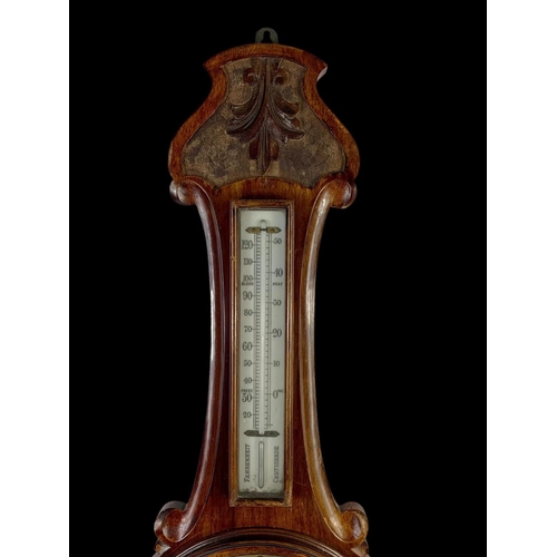 31 - A Edwardian mahogany barometer. 81cm.