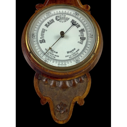 31 - A Edwardian mahogany barometer. 81cm.