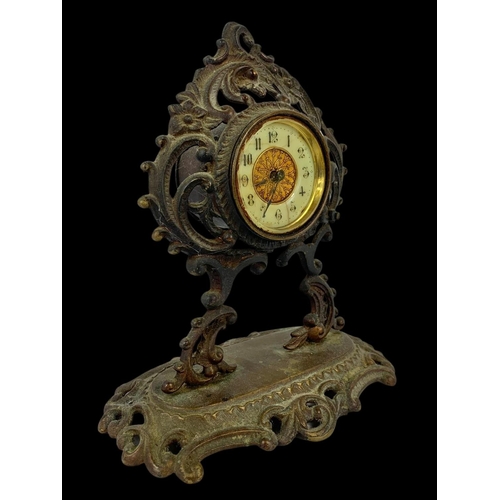 33 - A 19th century ornate brass wind up clock. Circa 1880. 18 x 20cm.