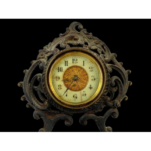 33 - A 19th century ornate brass wind up clock. Circa 1880. 18 x 20cm.