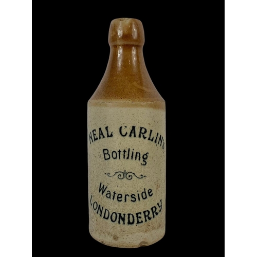 39 - A Neal Carlin stone bottle. Waterside Londonderry. 20cm.