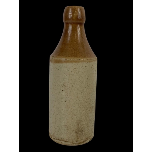 39 - A Neal Carlin stone bottle. Waterside Londonderry. 20cm.