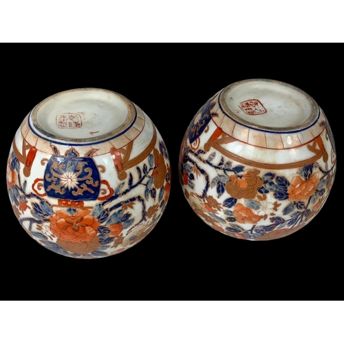 393 - A pair of large 19th century Japanese pottery ginger jars with lids. 18 x 18cm.