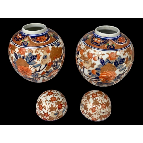 393 - A pair of large 19th century Japanese pottery ginger jars with lids. 18 x 18cm.