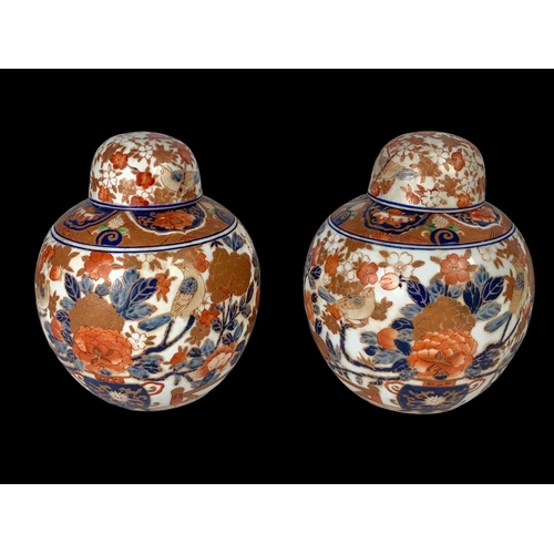 393 - A pair of large 19th century Japanese pottery ginger jars with lids. 18 x 18cm.