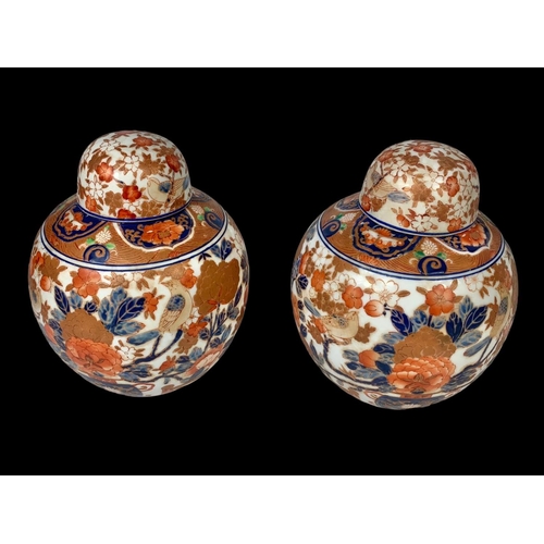 393 - A pair of large 19th century Japanese pottery ginger jars with lids. 18 x 18cm.