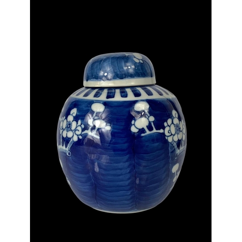 394 - A late 19th century Chinese blue and white Prunus ginger jar with lid. Circa 1900. 17cm