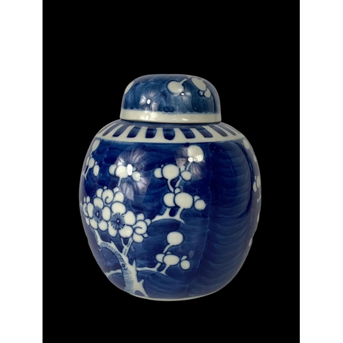 394 - A late 19th century Chinese blue and white Prunus ginger jar with lid. Circa 1900. 17cm