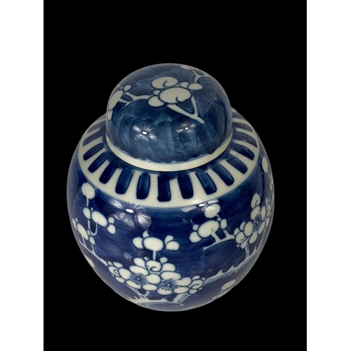 394 - A late 19th century Chinese blue and white Prunus ginger jar with lid. Circa 1900. 17cm