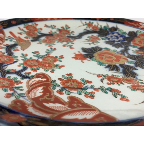 396 - A large 19th century Imari charger. 31.5cm