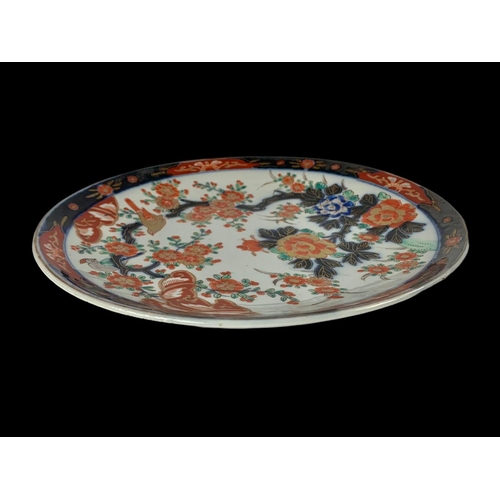 396 - A large 19th century Imari charger. 31.5cm