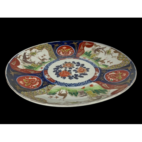 397 - A large 19th century Imari charger. 37cm.