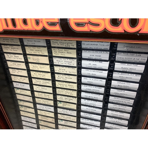 214 - Juke box with over 200 records, 70/53.5/129cm.