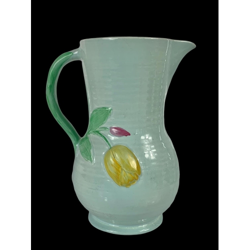 413 - A Crown Devon pottery jug. 24cm.