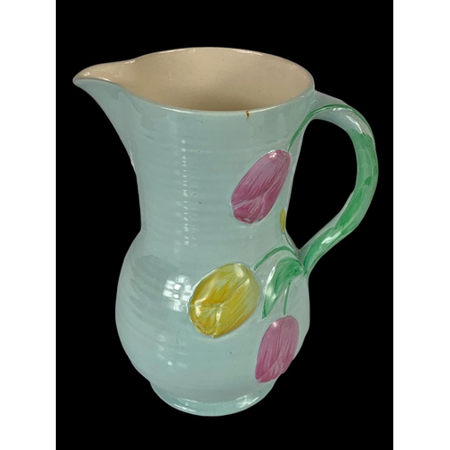 413 - A Crown Devon pottery jug. 24cm.