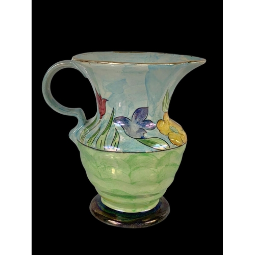 414 - A Kensington Ware lustre flower pattern jug 19cm.