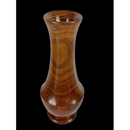 424 - An early 20th century Brazilian Tigerwood vase. 24cm