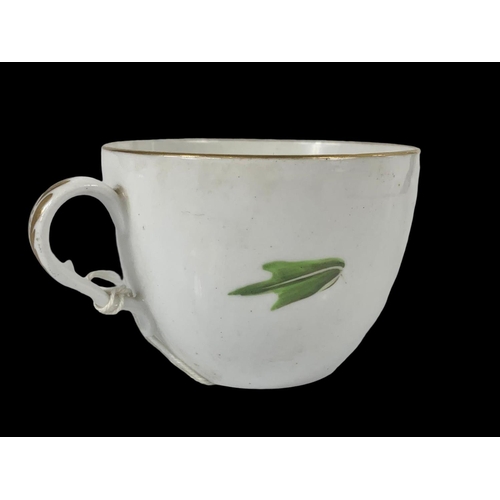 441 - An early 19th century Spode tea leaf pattern cup and saucer. Circa 1805-1810.