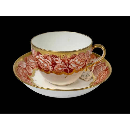 442 - An early 19th century Spode “Pluck & Dust” Rose pattern cup and saucer. Circa 1805.