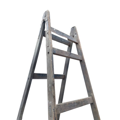 215 - Large early 20th century trestle stand, 303cm