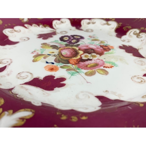 477 - A 19th century Rockingham Rococo style plate and 2 cups. Circa 1870. Number 203. Plate measures 22.5... 