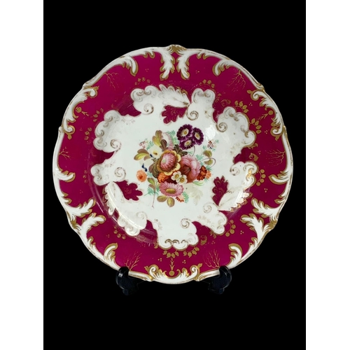 477 - A 19th century Rockingham Rococo style plate and 2 cups. Circa 1870. Number 203. Plate measures 22.5... 