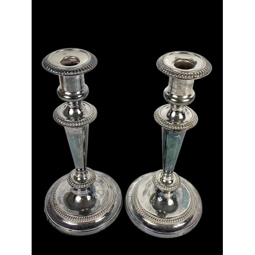 482 - A pair of vintage silver plated candlesticks. 27cm.