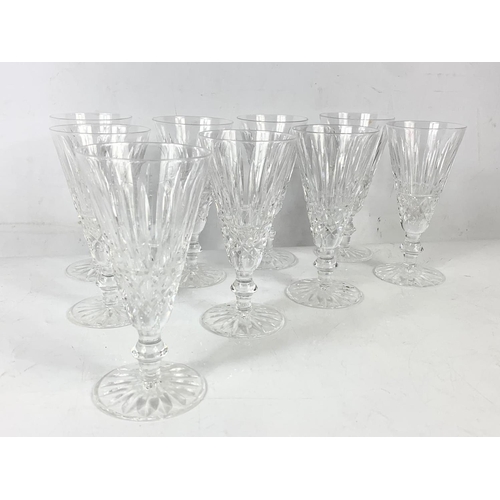 493 - A set of 9 Waterford crystal Tramore flute champagne glasses. 16cm.