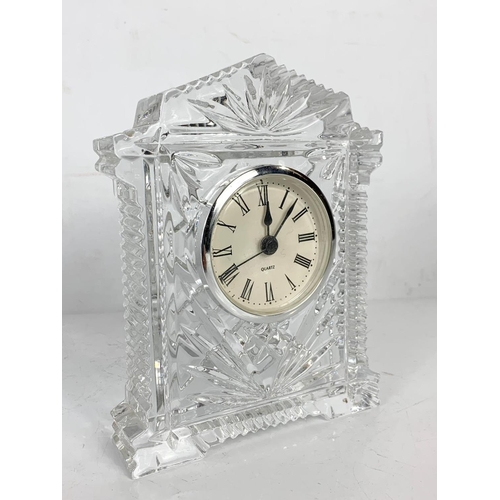 498 - 3 pieces of crystal. Decanter 26.5cm, vase 23.5cm and clock 15.5cm.