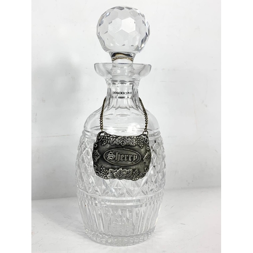 498 - 3 pieces of crystal. Decanter 26.5cm, vase 23.5cm and clock 15.5cm.