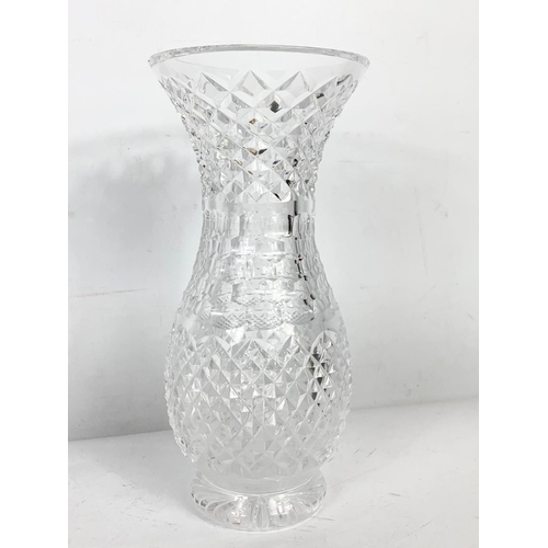 498 - 3 pieces of crystal. Decanter 26.5cm, vase 23.5cm and clock 15.5cm.