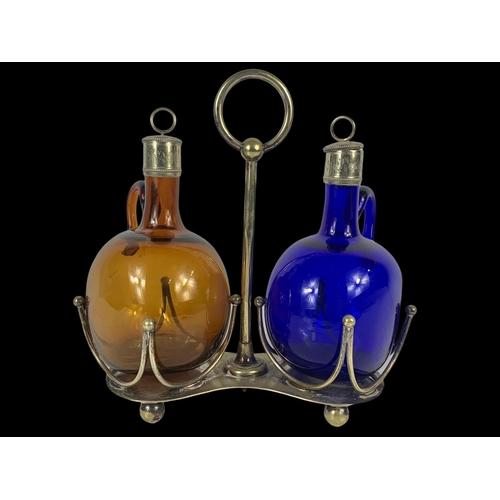 502 - 2 Victorian Bristol Blue and Amber glass decanter/flagons on a silver plated stand by Mappin & Webb.... 