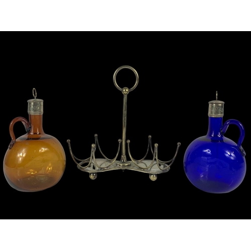 502 - 2 Victorian Bristol Blue and Amber glass decanter/flagons on a silver plated stand by Mappin & Webb.... 